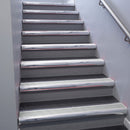 Polished Aluminium bullnose stair nosing 68x40mm with Satin Aluminium insert, fitted to an interior stairwell