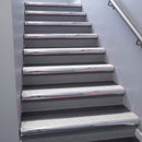Polished Aluminium bullnose stair nosing 68x40mm with White Castellated insert, fitted to an interior stairwell