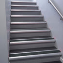 Satin Aluminium bullnose stair nosing 68x40mm with Black Olympic Grip insert, fitted to an interior stairwell