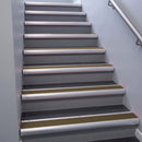 Satin Aluminium bullnose stair nosing 68x40mm with Bronze Aluminium insert, fitted to an interior stairwell