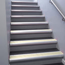 Satin Aluminium bullnose stair nosing 68x40mm with Porth Stone Smooth Textured insert, fitted to an interior stairwell