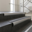 Aluminium bullnose stair nosing with Flint Castellated PVC infill, fitted to concrete steps in a commercial stairwell