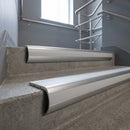 Mill Aluminium bullnose stair nosing with Polar Grey Smooth Textured PVC infill, fitted to concrete steps in a commercial stairwell