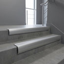 Mill Aluminium bullnose stair nosing with Satin Aluminium infill, fitted to concrete steps in a commercial stairwell