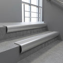 Aluminium bullnose stair nosing with Polar Grey Smooth Textured PVC infill, fitted to concrete steps in a commercial stairwell