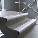 Aluminium bullnose stair nosing with Satin Aluminium infill, fitted to concrete steps in a commercial stairwell