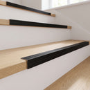 Black anodised aluminium 35x35mm ribbed stair nosing fitted to pale oak laminate stair treads
