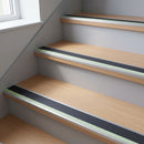 Midnight grey insert aluminium stair nosing fitted to light beech effect laminate treads on a university staircase