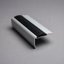 Aluminium stair nosing 57mm x 33mm shown alone on a plain studio background, bullnosed front edge and black grooved rubber insert visible