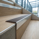 Aluminium Stair Nosing 59mm Tread Raked Back Profile in satin aluminium finish fitted on a step edge