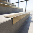 Slimline square back stair nosing 59x30mm in light bronze finish fitted on a step edge
