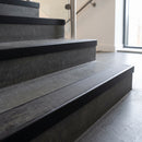 Black Anodised square edge aluminium stair nosing with Black Castellated infill, fitted to a concrete step