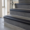 Black Anodised square edge aluminium stair nosing with Black Olympic Grip infill, fitted to a concrete step