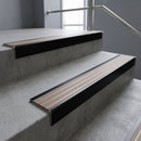 Black Anodised square edge aluminium stair nosing with Fawn Castellated infill, fitted to a concrete step
