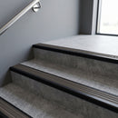 Black Anodised square edge aluminium stair nosing with Granite Castellated infill, fitted to a concrete step