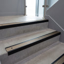 Black Anodised square edge aluminium stair nosing with Light Bronze Aluminium infill, fitted to a concrete step
