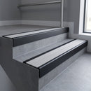 Black Anodised finish with Light Grey Castellated insert - Aluminium Stair Nosing 59x30mm Square Back fitted to a step edge