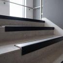 Black Anodised square edge aluminium stair nosing with Mill Aluminium infill, fitted to a concrete step