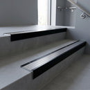 Black Anodised square edge aluminium stair nosing with Polished Aluminium infill, fitted to a concrete step