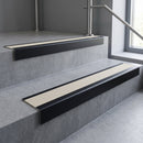 Black Anodised finish with Porth Stone Castellated insert - Aluminium Stair Nosing 63.3x30mm Square Front fitted to a step edge