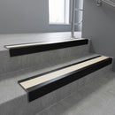 Black Anodised square edge aluminium stair nosing with Porth Stone Smooth Textured infill, fitted to a concrete step