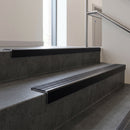 Black Anodised square edge aluminium stair nosing with Regency Castellated infill, fitted to a concrete step