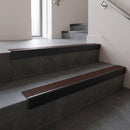 Black Anodised square edge aluminium stair nosing with Rustic Castellated infill, fitted to a concrete step