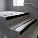 Black Anodised square edge aluminium stair nosing with Satin Aluminium infill, fitted to a concrete step