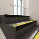 Black Anodised square edge aluminium stair nosing with Yellow Castellated infill, fitted to a concrete step