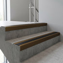 Bronze square edge aluminium stair nosing with Black Anodised Aluminium infill, fitted to a concrete step
