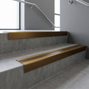 Bronze square edge aluminium stair nosing with Bronze Aluminium infill, fitted to a concrete step