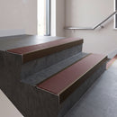 Bronze square edge aluminium stair nosing with Claret Castellated infill, fitted to a concrete step
