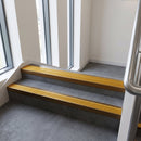 Bronze finish with Gold Castellated insert - Aluminium Stair Nosing 63.3x30mm Square Front fitted to a step edge