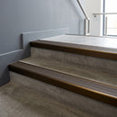 Bronze square edge aluminium stair nosing with Granite Castellated infill, fitted to a concrete step