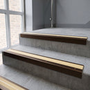 Bronze square edge aluminium stair nosing with Ivory Castellated infill, fitted to a concrete step