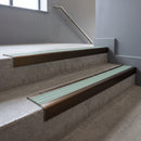 Bronze square edge aluminium stair nosing with Jade Castellated infill, fitted to a concrete step
