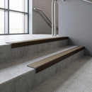 Bronze square edge aluminium stair nosing with Light Bronze Aluminium infill, fitted to a concrete step
