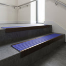 Bronze finish with Mid Blue Castellated insert - Aluminium Stair Nosing 59x30mm Square Back fitted to a step edge
