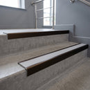 Bronze finish with Polar Grey Castellated insert - Slimline Square Back Stair Nosing 59x30mm Aluminium fitted to a step edge