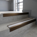 Bronze square edge aluminium stair nosing with Polar Grey Smooth Textured infill, fitted to a concrete step