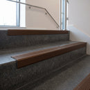 Bronze square edge aluminium stair nosing with Regency Castellated infill, fitted to a concrete step