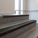 Bronze square edge aluminium stair nosing with Spruce Castellated infill, fitted to a concrete step