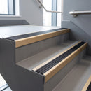 Light Bronze square edge aluminium stair nosing with Black Anodised Aluminium infill, fitted to a concrete step