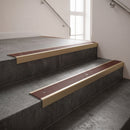 Light Bronze square edge aluminium stair nosing with Claret Castellated infill, fitted to a concrete step