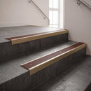 Light Bronze finish with Claret Castellated insert - Slimline Square Back Stair Nosing 59x30mm Aluminium fitted to a step edge