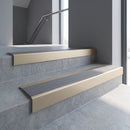 Light Bronze square edge aluminium stair nosing with Flint Castellated infill, fitted to a concrete step