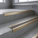 Light Bronze square edge aluminium stair nosing with Granite Castellated infill, fitted to a concrete step