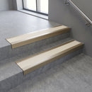 Light Bronze square edge aluminium stair nosing with Ivory Castellated infill, fitted to a concrete step
