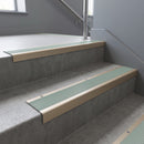 Light Bronze square edge aluminium stair nosing with Jade Castellated infill, fitted to a concrete step