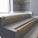 Light Bronze square edge aluminium stair nosing with Light Bronze Aluminium infill, fitted to a concrete step